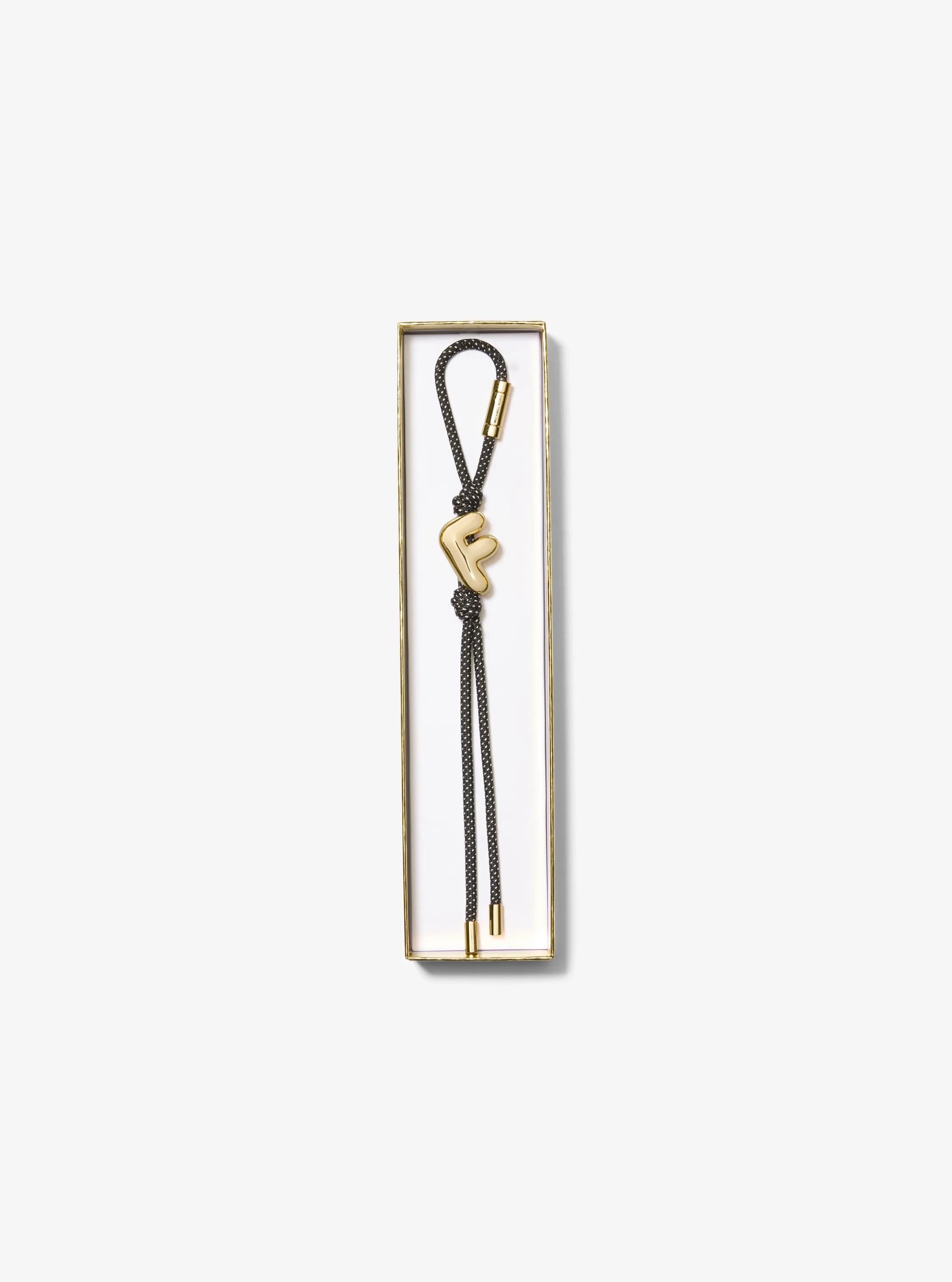 Initial Gold-Tone and Speckled Cord Bag Charm