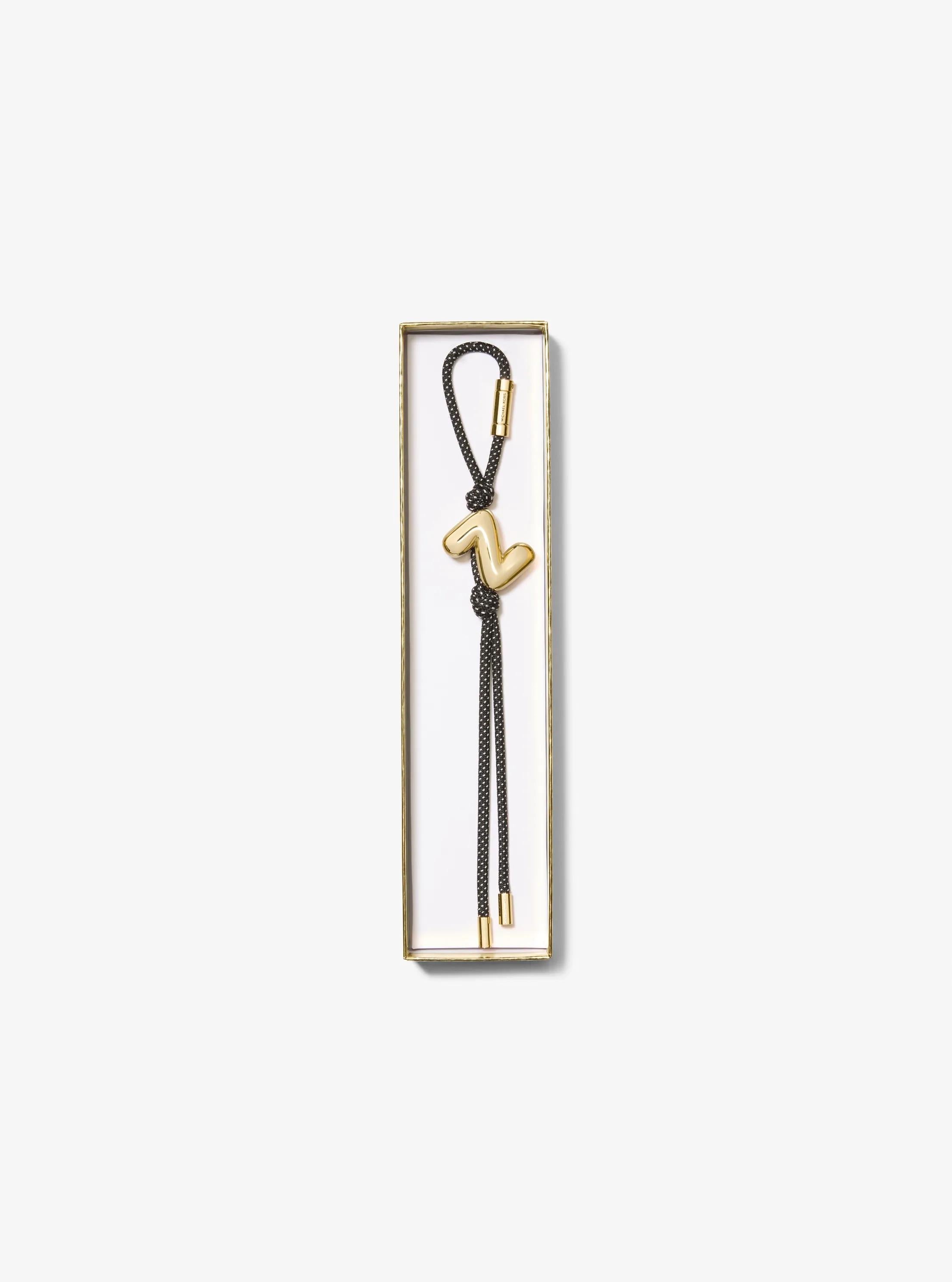 Initial Gold-Tone and Speckled Cord Bag Charm