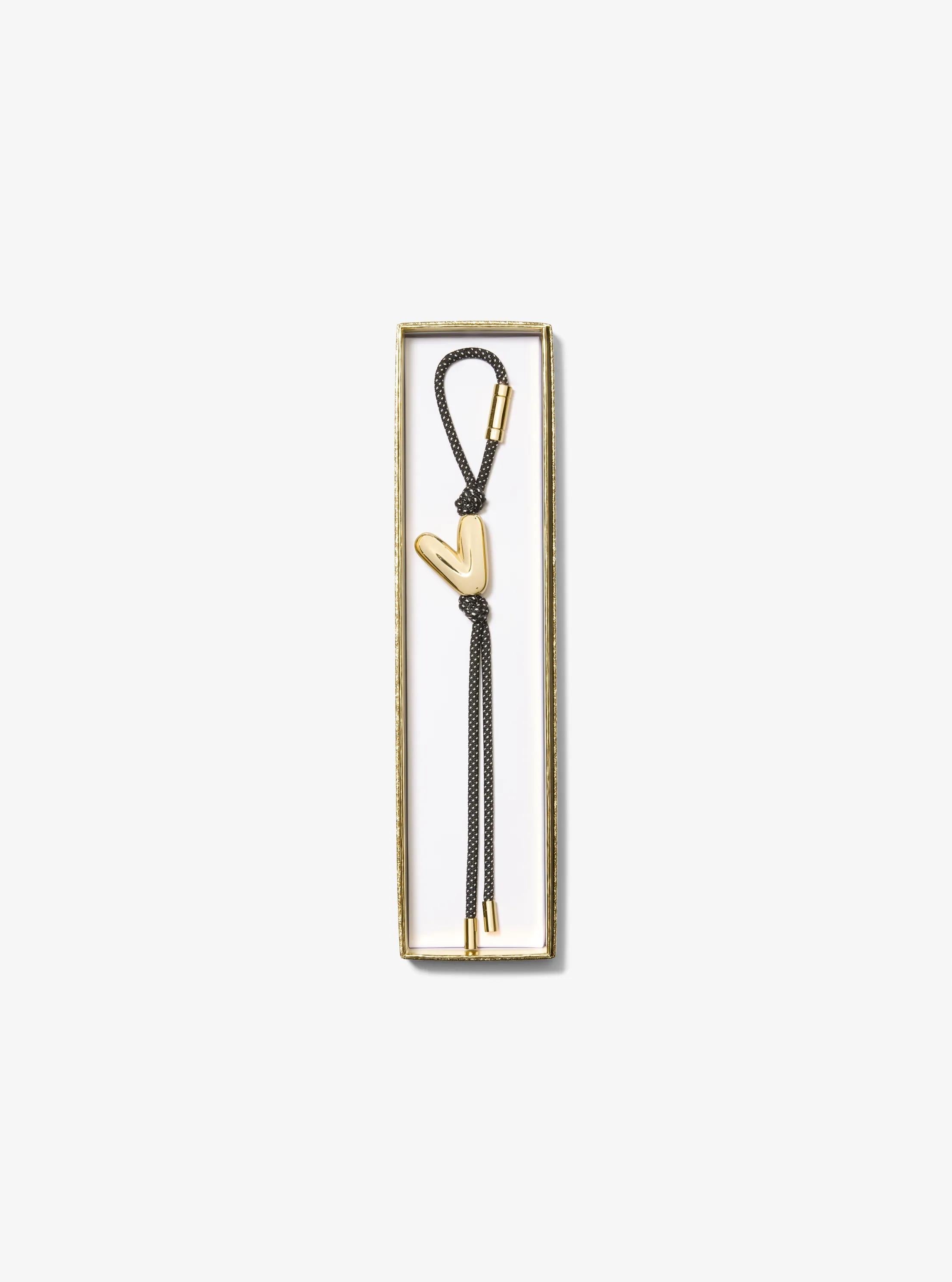 Initial Gold-Tone and Speckled Cord Bag Charm